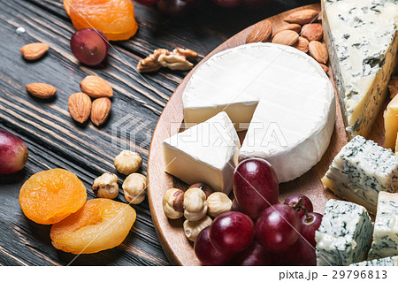variety of cheeses with grapes and dried fruits variety of cheeses with grapes and dried fruits 29796813