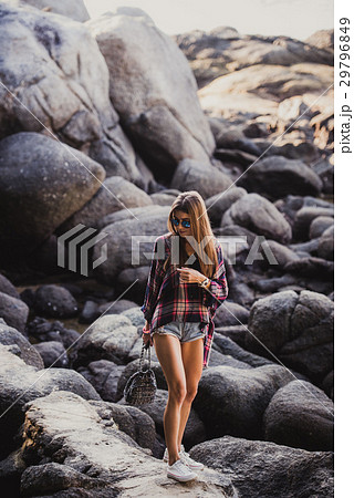 Stylish hipster woman in checkered shirt and 29796849