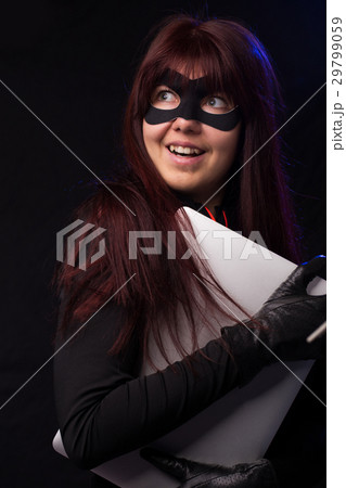 Hacker in mask holds laptop 29799059
