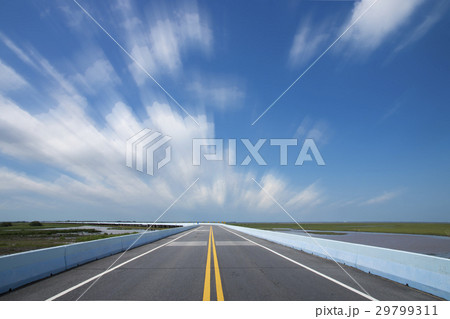 Empty road and the yellow traffic lines 29799311