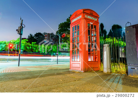 Traditional british phone box at night 29800272