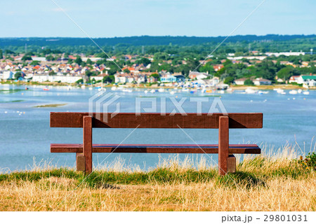 Bench with out of focus town 29801031