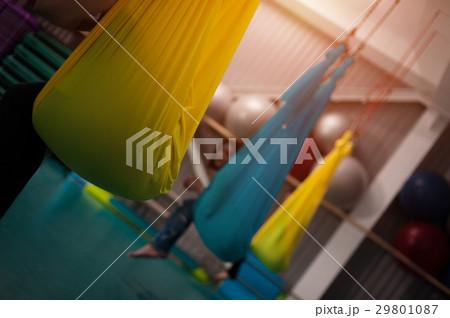 Women practicing yoga fly in hammocks Women practicing yoga fly in hammocks 29801087