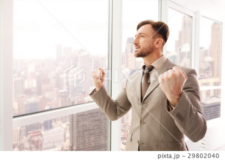 Successful businessman expressing confidence in 29802040