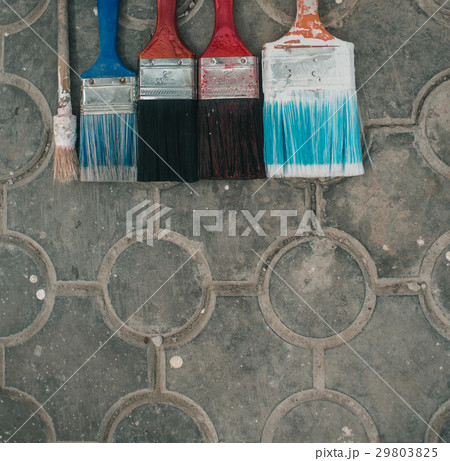 Paint brushes on the old tile background Paint brushes on the old tile background 29803825
