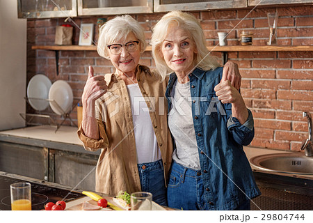 Happy mature female friends showing ok sign 29804744