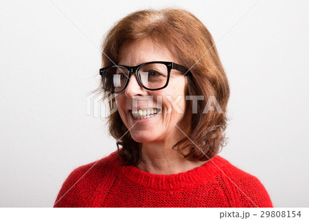 Senior woman in black eyeglasses and sweater 29808154