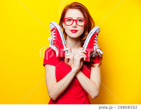 young woman with red gumshoes young woman with red gumshoes 29808502