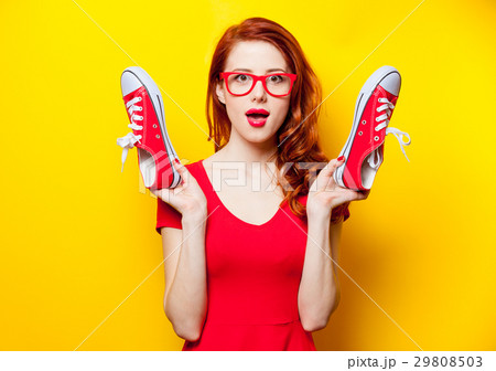 young woman with red gumshoes  29808503