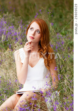 photo of beautiful young woman with copybook 29809029