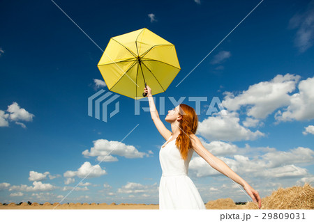 photo of beautiful young woman with umbrella 29809031