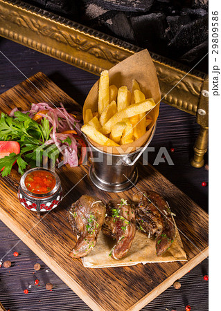 The uvulas of a ram fried on coals are served with 29809586