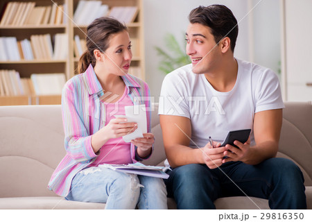 Young family discussing family finances Young family discussing family finances 29816350