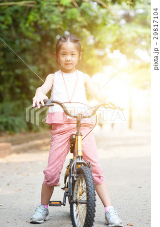 Asian child riding bikes outdoor. Asian child riding bikes outdoor. 29817104