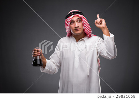 Arab with oil on gray background 29821059