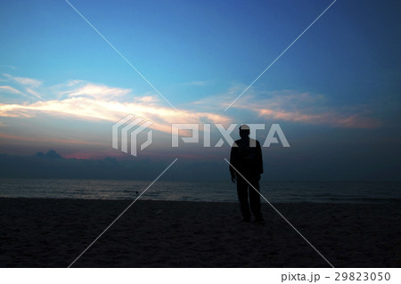 silhouettes on beach at sunrise silhouettes on beach at sunrise 29823050