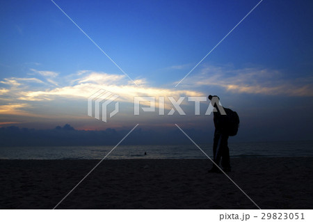 silhouettes on beach at sunrise silhouettes on beach at sunrise 29823051