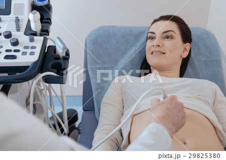 Attentive motivated woman listening to her 29825380