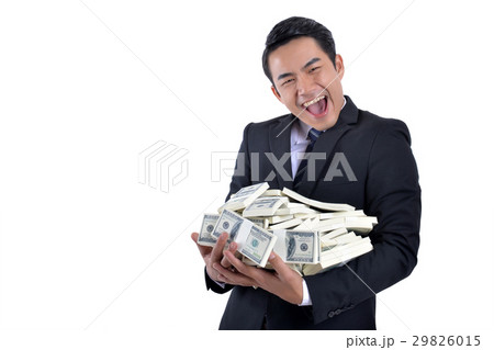 A lot of money in the hands of a young businessman 29826015