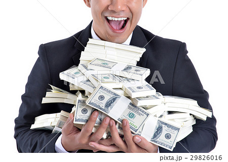 A lot of money in the hands of a young businessman 29826016