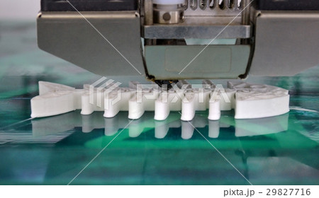 3D printer working and creating an object from the 3D printer working and creating an object from the 29827716