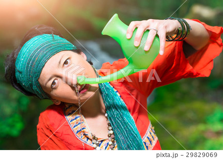 Jala neti nasal irrigation with a woman in nature 29829069