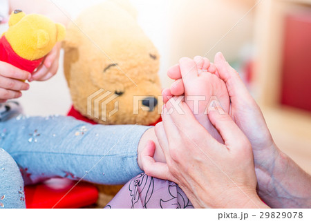 Reflexology foot massage to a female child 29829078