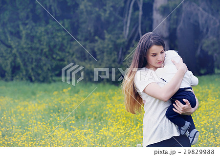 mother embracing her child mother embracing her child 29829988