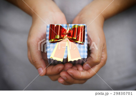 Blue Gift box on women hands. Blue Gift box on women hands. 29830701