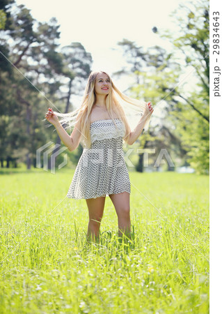 Women enjoying nature in meadow.  29834643