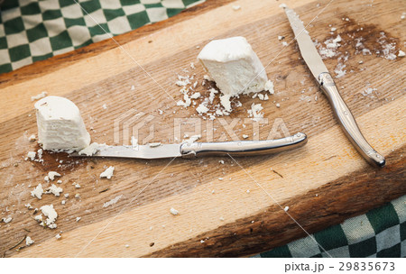 Cheese with knives lay on wooden cutting desk Cheese with knives lay on wooden cutting desk 29835673
