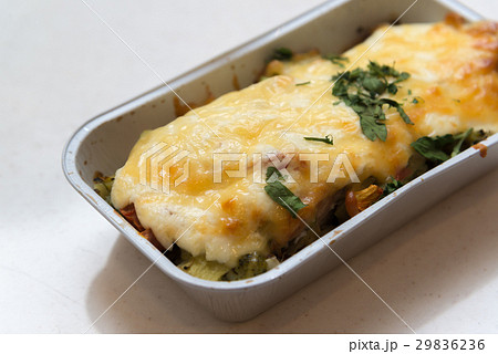 Trout baked with vegetables and cheese in batch Trout baked with vegetables and cheese in batch 29836236