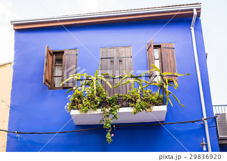 Balconies and the walls blue. 29836920