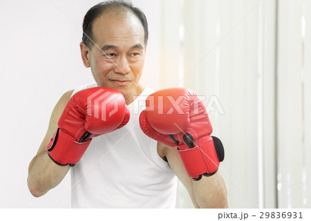 Asian senior fighter man with red boxing gloves 29836931