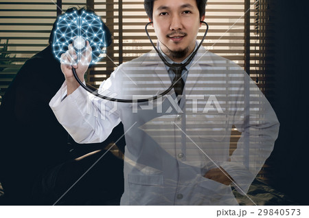 Asian Doctor hand holding the stethoscope equipment on brain over depressed man sitting head in hands on the bed in the dark bedroom, physician of darmatic concept Asian Doctor hand holding the stethoscope equipment on brain over depressed man sitting head in hands on the bed in the dark bedroom, physician of darmatic concept 29840573