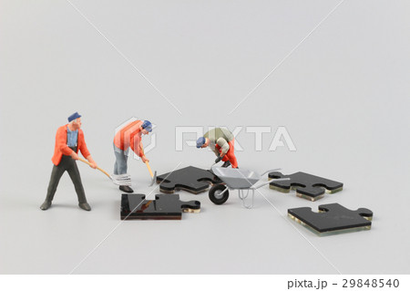 people collaborate holding up puzzle pieces people collaborate holding up puzzle pieces 29848540