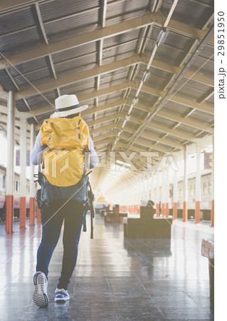 woman on train station platform with backpack  29851950