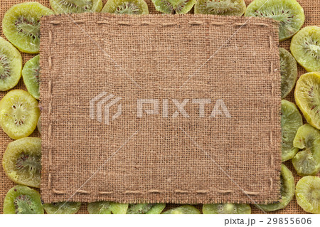 Frame made of burlap with the line lies on kiwi 29855606