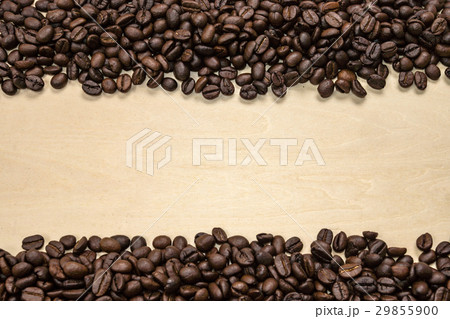 Coffee beans on the wood background. Coffee beans on the wood background. 29855900
