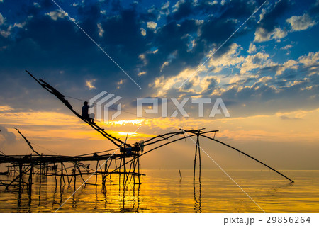 Silhouette of bamboo machinery in the lake. Silhouette of bamboo machinery in the lake. 29856264