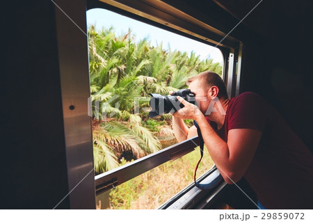 Man traveling by historical train Man traveling by historical train 29859072