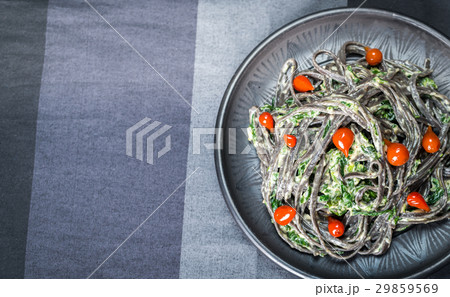 Black pasta with spinach, mascarpone and Parmesan Black pasta with spinach, mascarpone and Parmesan 29859569