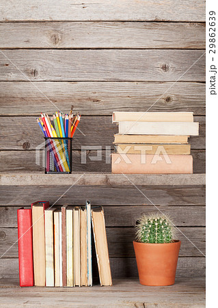 Old books on a wooden shelf 29862639