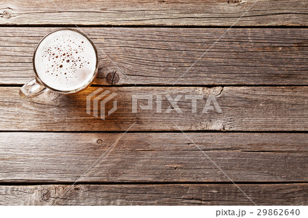 Beer mug on wooden table 29862640