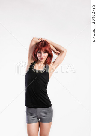 Attractive young fitness woman in green tank top 29862735
