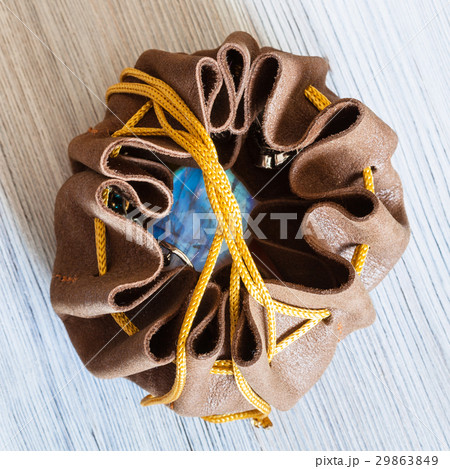 top view of open leather purse with moonstone gem top view of open leather purse with moonstone gem 29863849