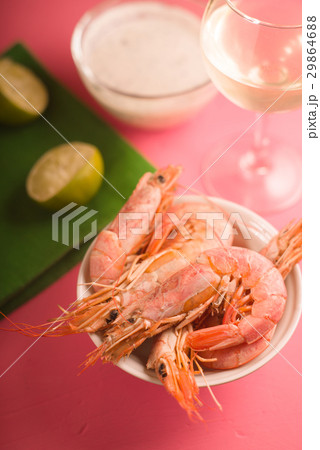 Shrimps in a ceramic bowl, a glass of white wine Shrimps in a ceramic bowl, a glass of white wine 29864688