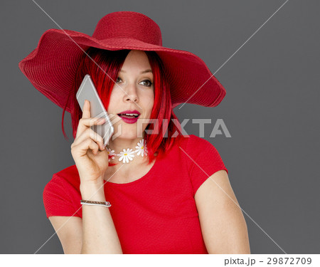 Caucasian Woman in a Red Dress Talking on the Phone 29872709
