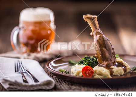 Confit lamb shank with mashed potatoes. 29874231