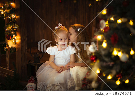 girlfriends girls under the Christmas tree, bokeh girlfriends girls under the Christmas tree, bokeh 29874671